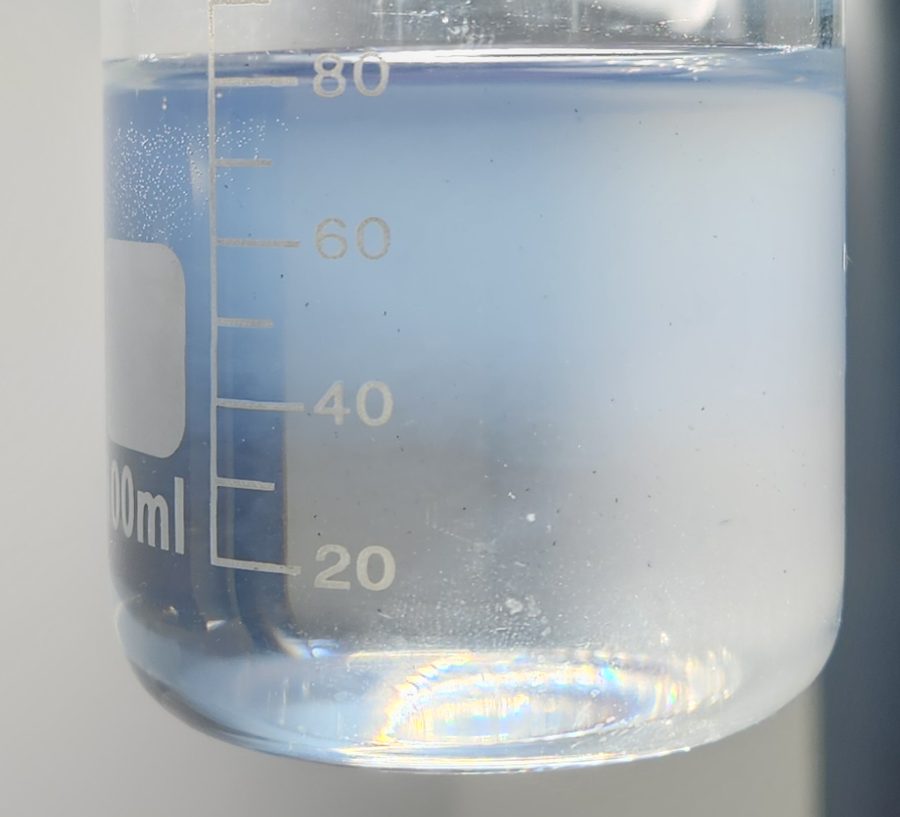 Beaker with a pale bluish colloid
